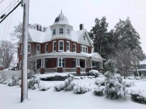Major snowstorm kicks off 2022 16 a house covered in snow in front of a building