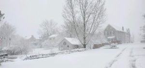 Major snowstorm kicks off 2022 25 a house covered in snow