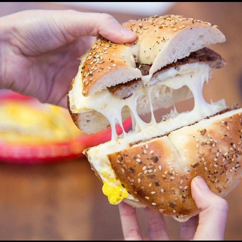 a close up of a hand holding a sandwich