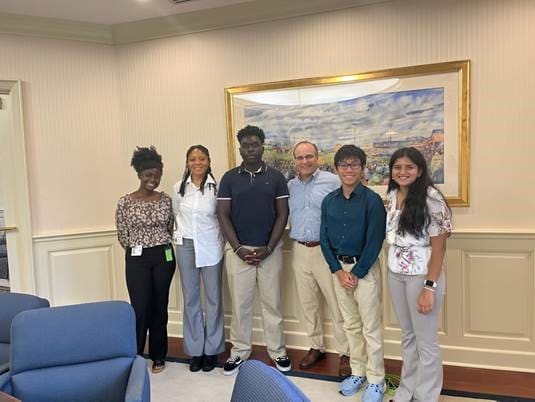 From left, Tyasia Cannon, MayEllen Clark, Caleb Odou, Chip Rossi (president of Bank of America Delaware), Timothy Nguyen, Samhitha Vallury.