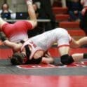 Smyrnas Kyle Davis attempts to roll out of the grasp of Nick Hendricks in their 132 pound match. Hendricks won 7 5. Photo by Pam Lane