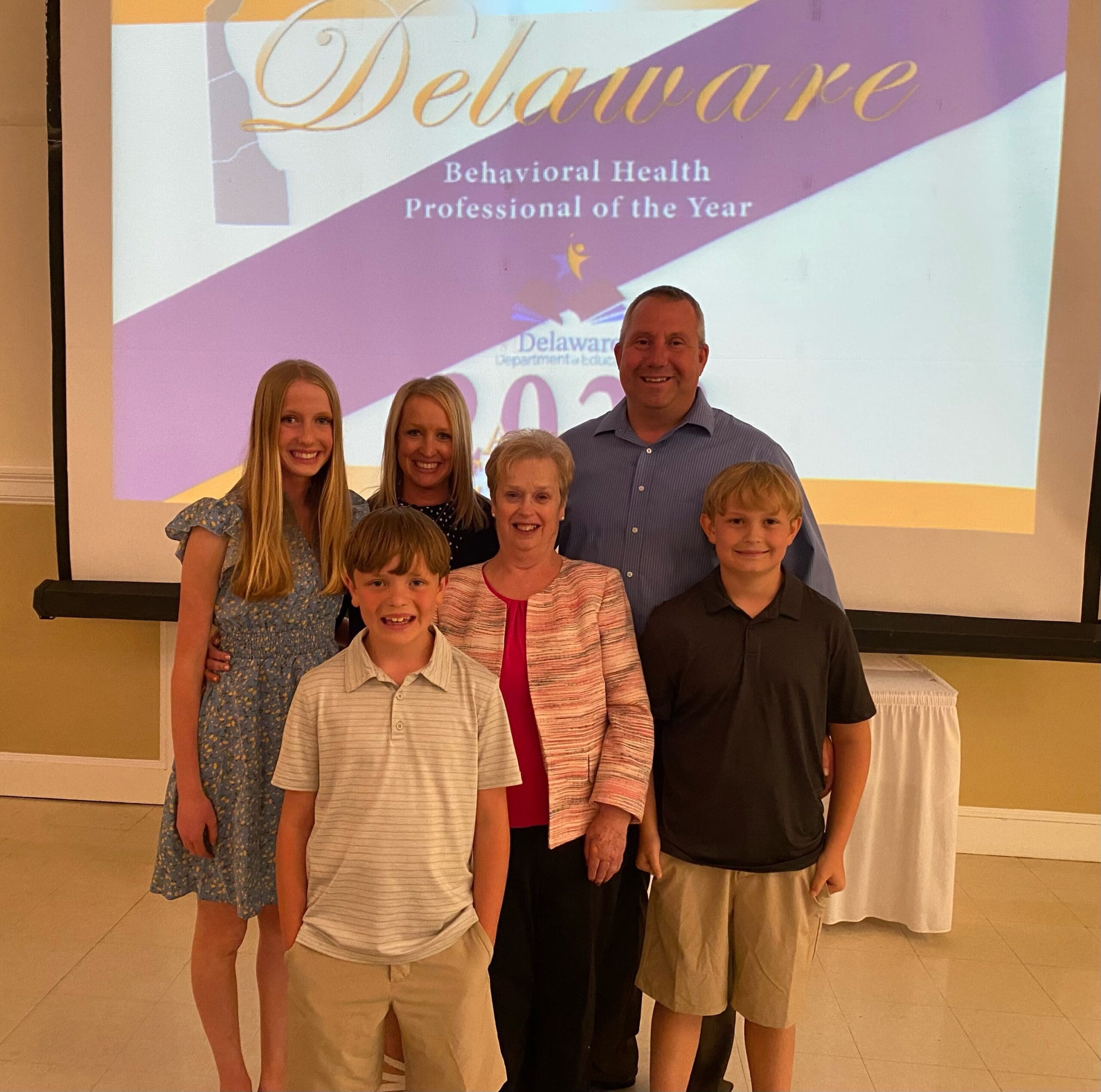 Dana Carey and her family after accepting the award at a ceremony in Dover last Thursday. 