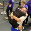 Frederica's Brian Perry defies odds, becomes an Olympian 7 Brian jumping into Coach James arms after winning the medal photo courtesy of Christine and Manny Perry