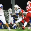 Dover football John Parker runs the ball against Smyrna photo courtesy of Donnell Henriquez
