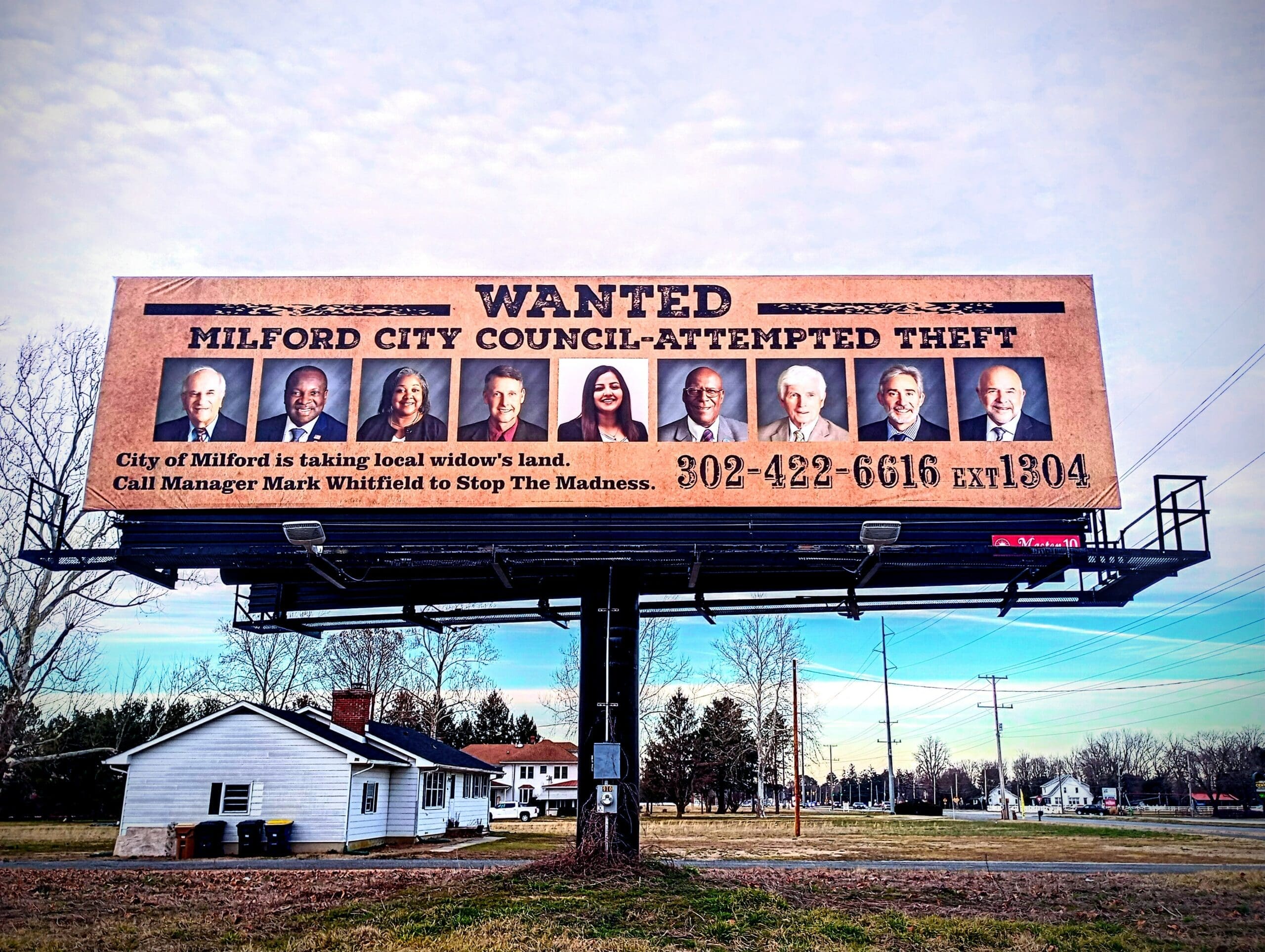 Featured image for “Billboard mocks Milford mayor, council as wanted for theft”