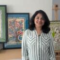 Artist Shilpi stands in front of her work. The Mezzanine Gallery will showcase her solo exhibit “Divine Nature” through August. (Photo courtesy of Delaware Division of Arts)