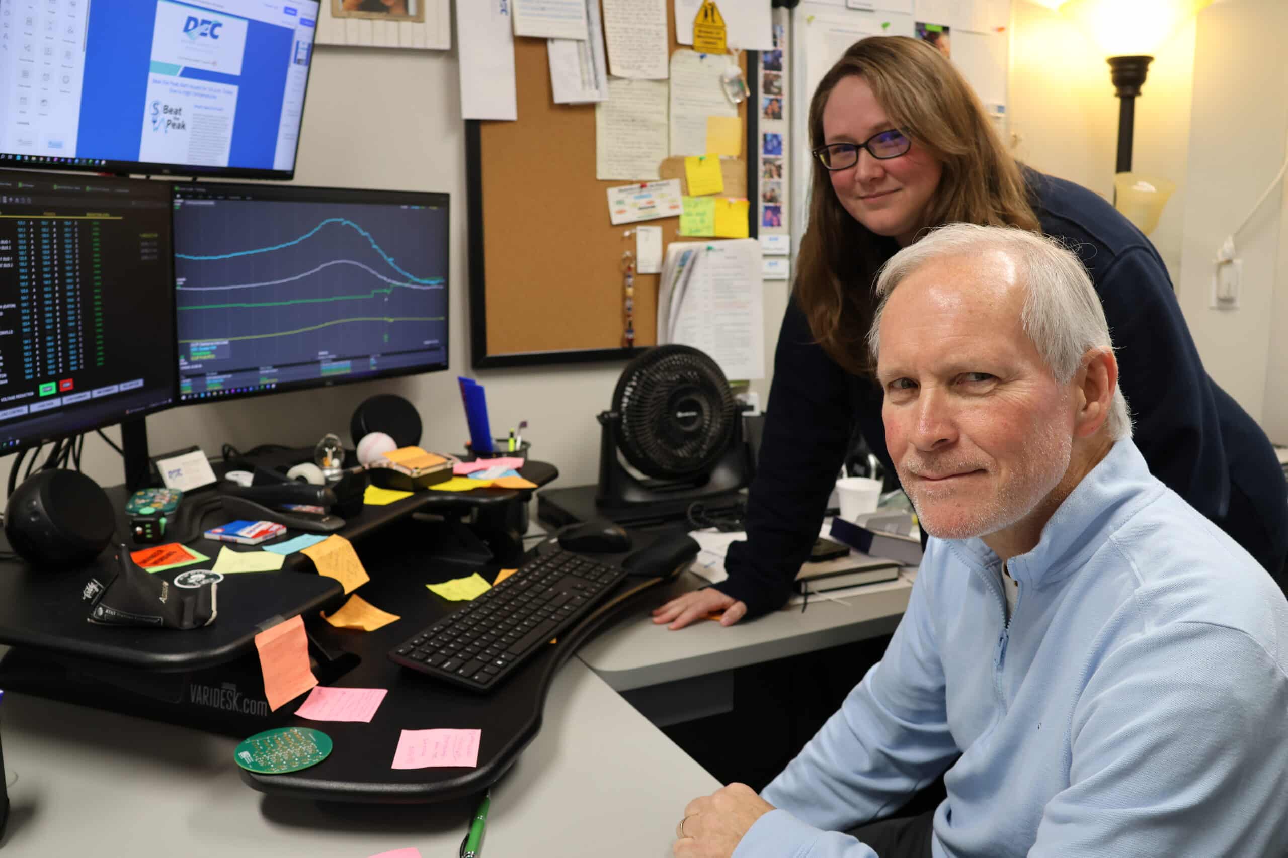 DEC’s Brittany Wagner, Manager of Operational Technology & System Controls, and Technology Support Analyst Rick Kinnikin monitor system demand as part of the Beat the Peak program, which helped members save millions in 2025. (Photo credit: Delaware Electric Cooperative)