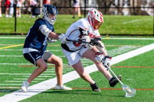 Photo Gallery: Smyrna vs Friends Boys Lacrosse 4 Smyrna's junior attackman Grayson Judy (34) fights for the ball against Friends defenseman senior Stone Davis (88)