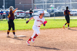 Junior Savanah Arnold rounds second and heads for third in the Eagles' second game of the season.