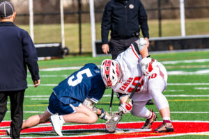 Photo Gallery: Smyrna vs Friends Boys Lacrosse 9 Smyrna's Elijah Mann(40) controls the ball on the faceoff against Friends Kyle Sullivan (5)