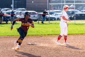 Senior Adrionna Fountain running the bases in Milford's game against Smyrna on March 26.