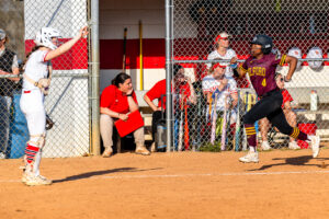 Fountain hustles home as one of five Buccaneer runs scored against the Eagles.