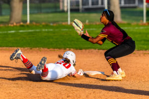 Smyrna freshman Lily Dixon slides in head first into second base in Smyrna's, 6-5, win over Milford. The Eagles are undefeated to start the season.