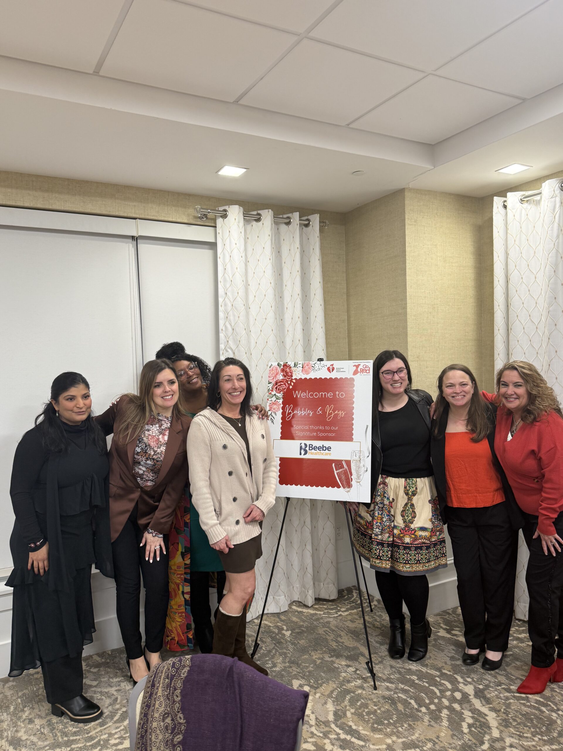 More than 50 attendees gathered March 4 for the inaugural “Bubbles and Bags” event hosted by the American Heart Association at the Hyatt Place Dewey Beach, raising $5,000 for the Go Red for Women campaign and women’s heart health initiatives in Delaware. (Photo courtesy of American Heart Association.)