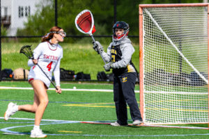 Padua sophomore Cassidy Cordery looks for a teammate to pass to while in the cage.