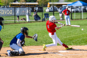 Eagle junior Matthew Passero swings at the Dover pitch. Passero hit a triple in the game.
