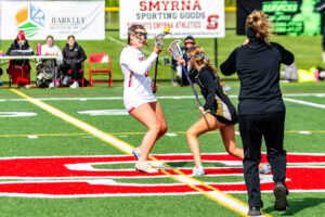 The Smyrna Eagles and Padua Pandas fight for possession on the face off.