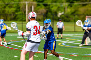 Jaden Nock defends Smyrna junior Grayson Judy away from the cage.