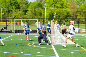 Sussex Central goalie Shane McCray concentrates on making the save on a high shot.
