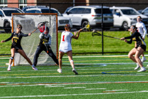 Smyrna senior Alexis Hutchison sets up her shot in front of the cage.