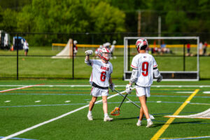 Smyrna juniors Drew Marks and Michael Pierson celebrate on the field. The Eagles are 5-3 this season.
