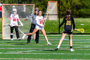 Smyrna junior Elizabeth Nicholson has possession in Smyrna's defensive end, looking for a pass.