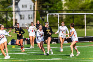 Padua freshman Ella Lewis keeps possession as a couple Smyrna defenders come to defend.