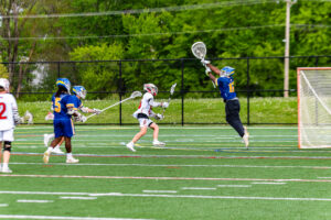 Shane McCray makes the leaping catch to stop a Smyrna goal.