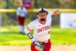 Smyrna junior Alexis Dennis starts her windup, pitching for the Eagles.
