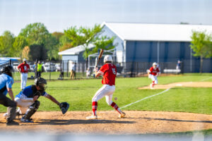 Smyrna junior Hunter Strauss watches as the pitch comes towards the plate.