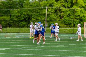 Sussex Central junior Cooper Altemus celebrates with Weatherley after the goal.
