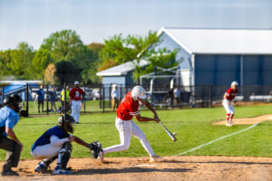 Smyrna senior Chase Pritchett makes contact in the batter's box.