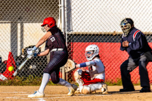 Polytech freshman Tenley Lord makes contact with the ball for one of her three hits of the game.