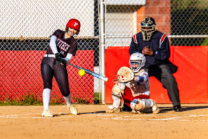 Polytech sophomore Kortney Brown connects with the ball for one of her two hits of the game.