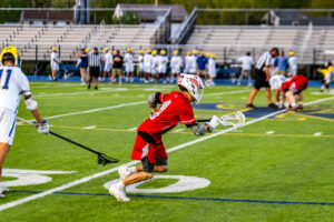 Smyrna senior Tannin Bell takes off as the faceoff is underway.