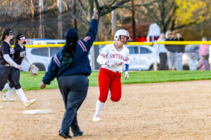 Adison Weisenberger circles the base paths after hitting a home run. Weisenberger hit two home runs in the game. 