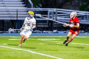 Rider junior Braxton Faircloth being defended by Eagle senior Reed Schultz.