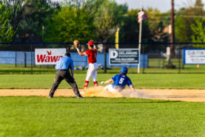 Dover senior Jeremy Drago slides into second. Drago hit the Senators' only double.