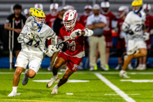 CR junior Jack Scala tries to get past Eagle senior Braeden Marshall.