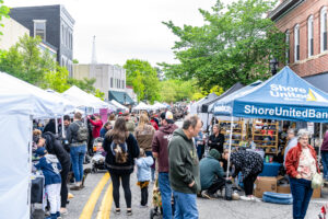 Attendees look around at the many vendors lining the streets of downtown Milford. 