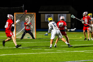 Evans is tasked with saving another close shot by Caesar Rodney senior Tanner Smith.