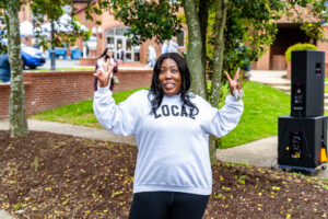 Executive Director of Downtown Milford Inc., Sade Truiett, enjoys the weekend event.