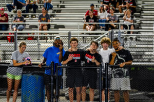 A group of Smyrna and Caesar Rodney fans enjoying the game together.