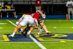 The Eagles and Riders battle for a faceoff win in their only regular season meeting this year.