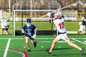 Photo Gallery: Smyrna vs Friends Boys Lacrosse 17 Smyrna's Reed Schultz (12) shoots the ball and scores as Friends Owen Strauss (21) closes in