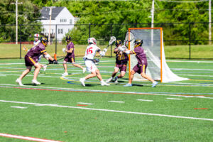 Smyrna freshman Aiden McLaughlin scores a goal near the front of the cage.