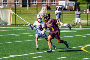 Milford senior Carson Fruehauf (7) and Smyrna junior Michael Pierson (6) locked into a one on one battle.