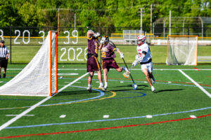 Smyrna junior Drew Marks watches his shot hit the back of the cage. The Eagles finished the game with 16 goals. 