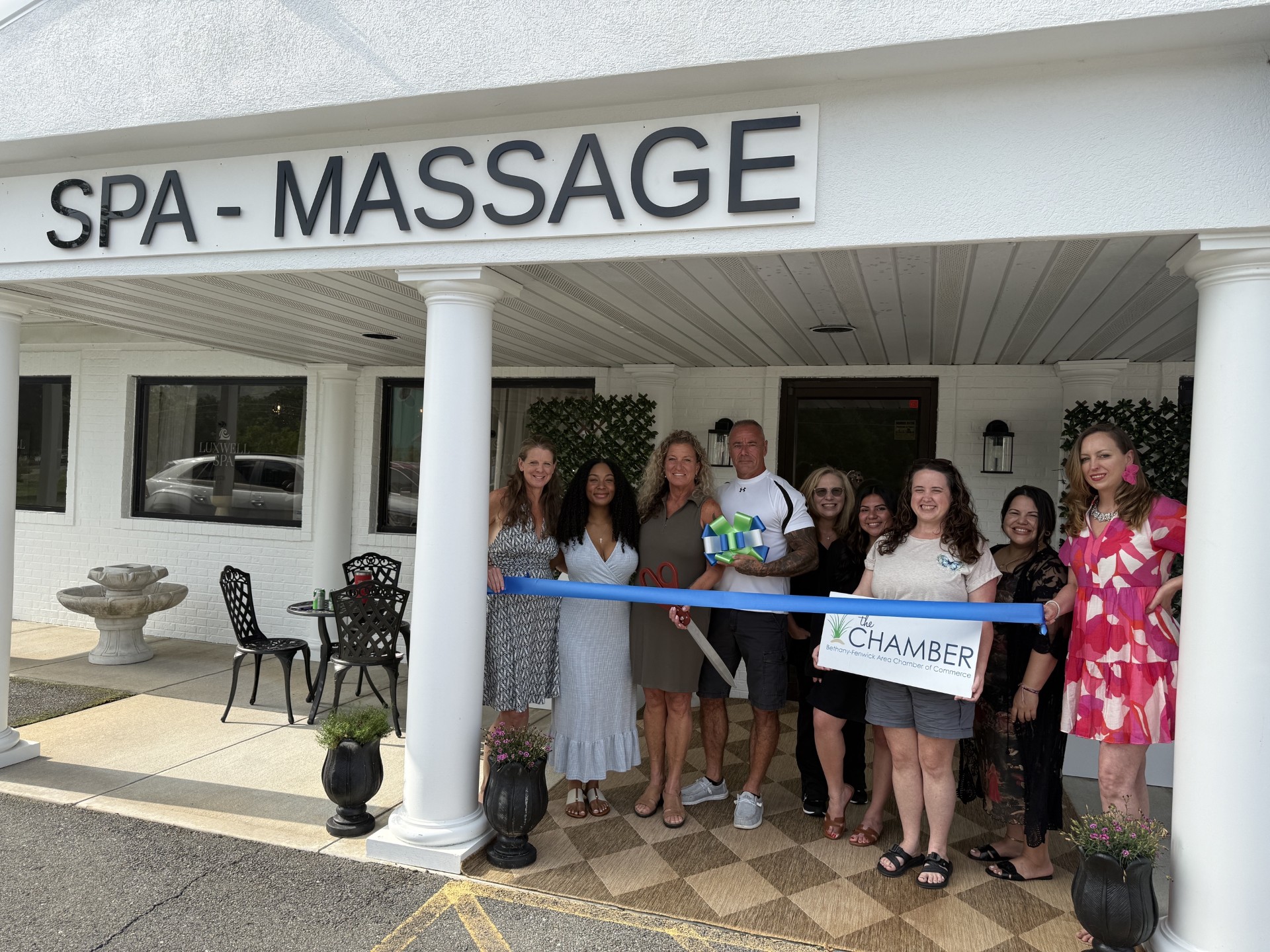 Carol and Mike Gruden celebrated the new ownership of Luxwell Spa with a ribbon-cutting ceremony July 7 alongside the Bethany-Fenwick Area Chamber of Commerce, community members and the spa's team. (Photo courtesy of Bethany-Fenwick Area Chamber of Commerce.)